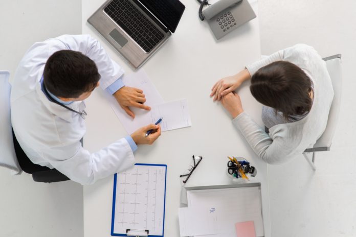 doctor with prescription and patient at hospital doctor with prescription and patient at hospital
