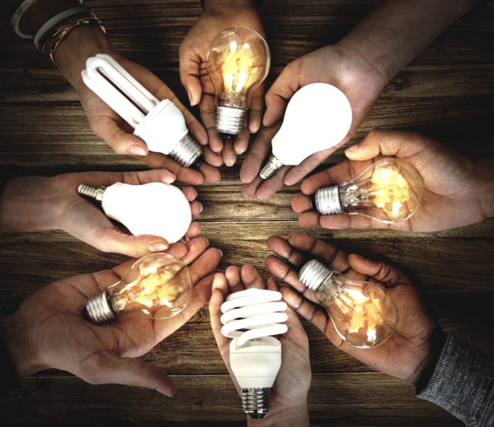 Hands Show Light Bulb Ideas Together Partnership Hands Show Light Bulb Ideas Together Partnership